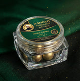 ASHFAQ Hakeem Herbal Tablets in clear jar with gold label on green fabric