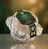 ASHFAQ Hakeem Zaafrani Tablets jar with saffron pieces, green label, and gold accents