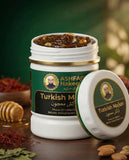 ASHFAQ Hakeem Turkish Majun herbal supplement jar with visible nuts and honey on a wooden table.